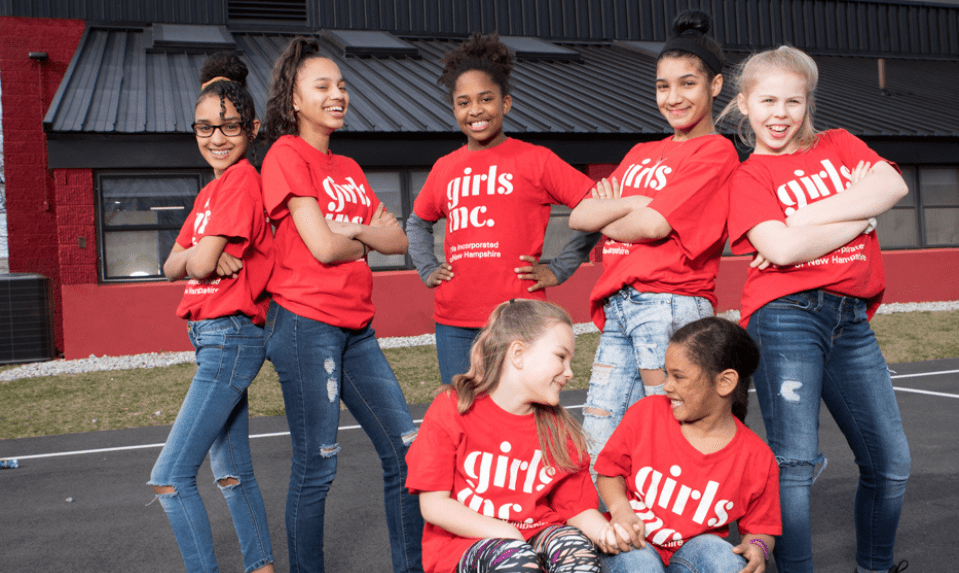 group of seven girls with red shirts